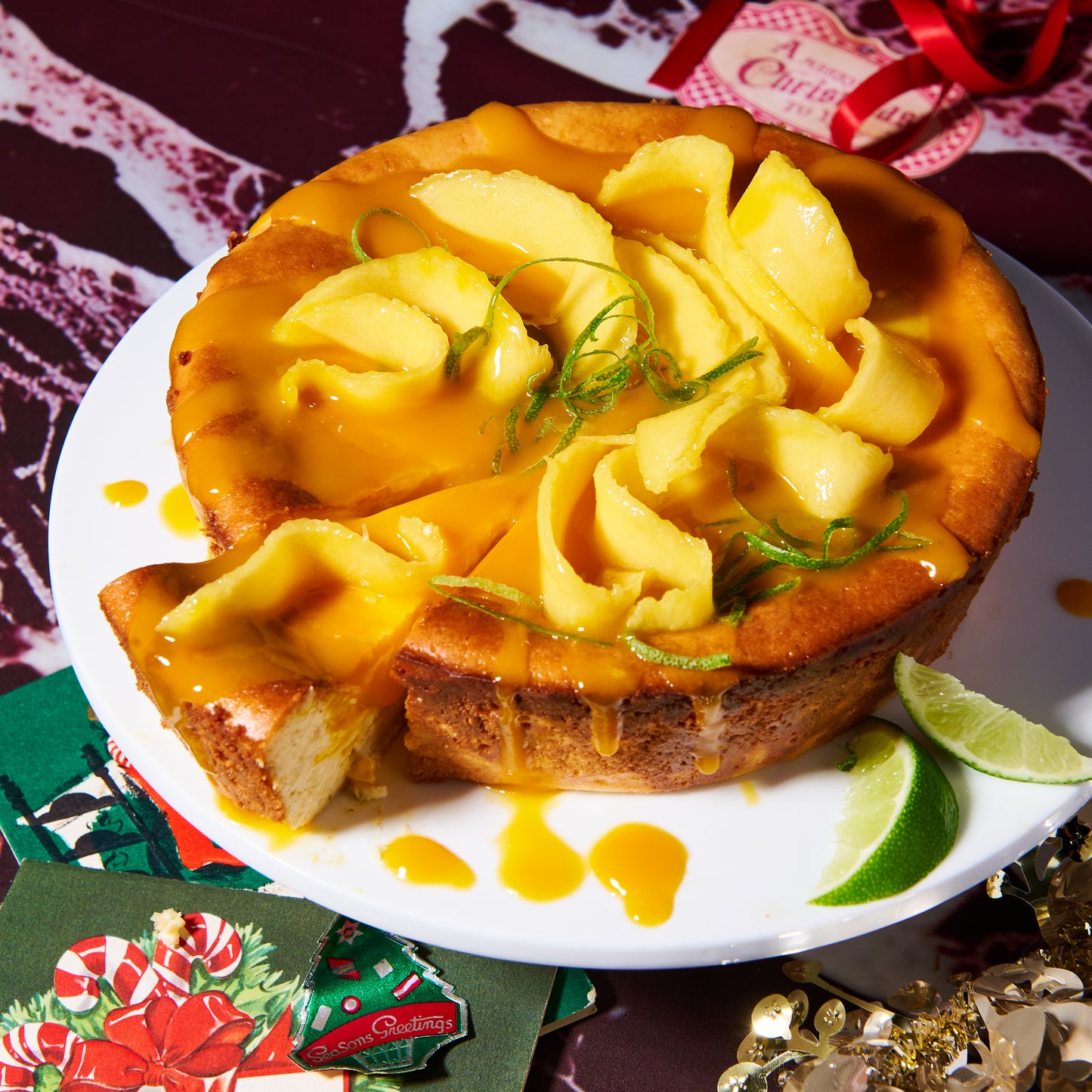 Bake-at-home coconut and lime cheesecake with mango coulis sliced
