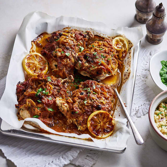 Traybake of Syrian chicken with honey, lemon and ginger, cooked until golden with caramelised sauce.