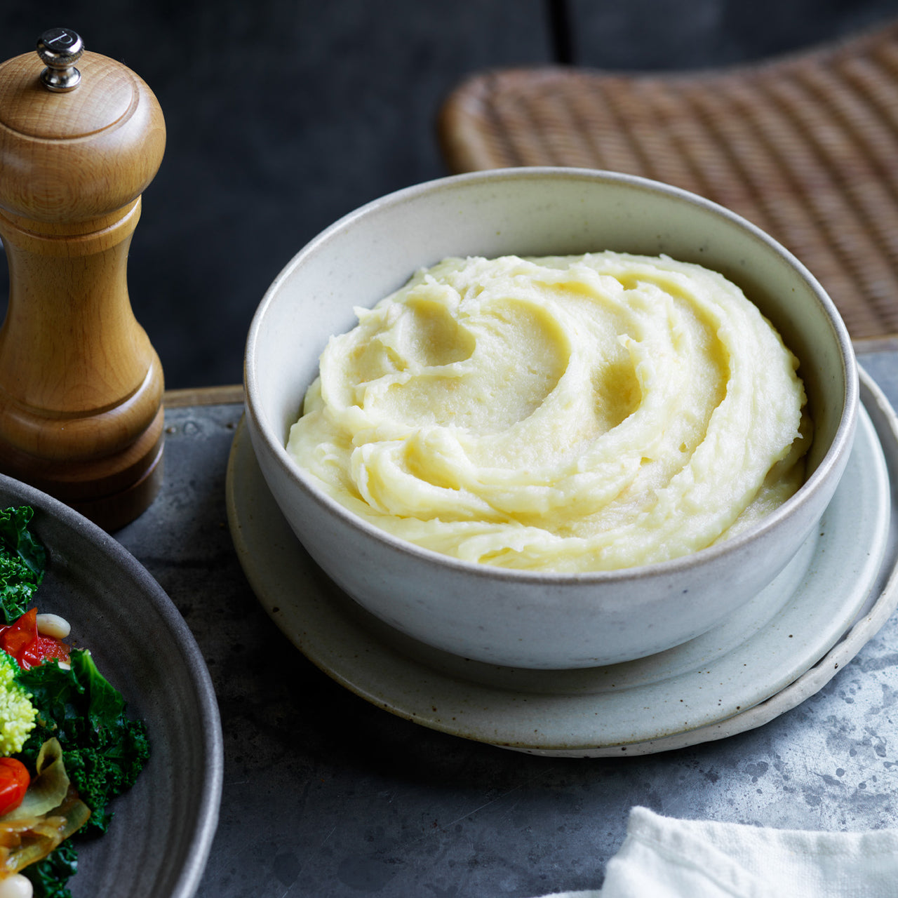 Bowl of fluffy buttered mashed potato, creamy and smooth
