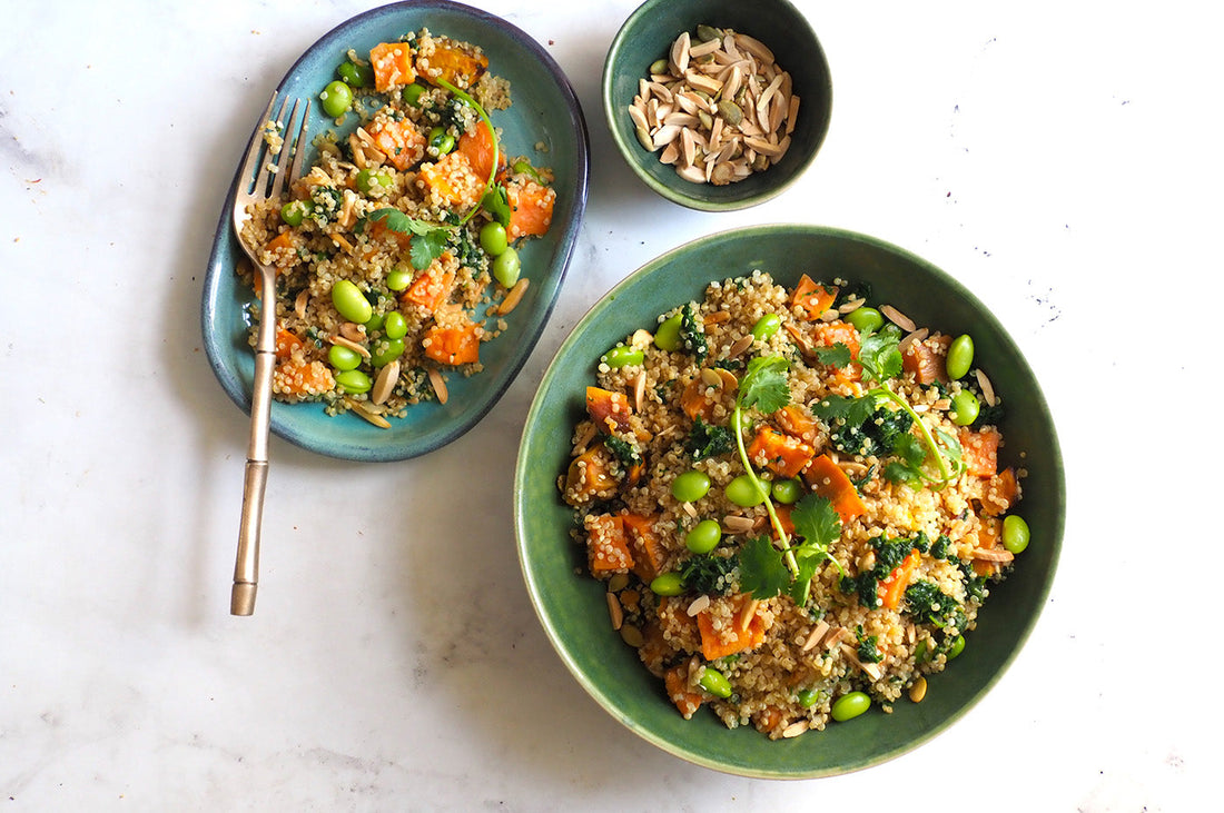 Bowl of superfoods salad with quinoa, sweet potato, edamame, and almonds.