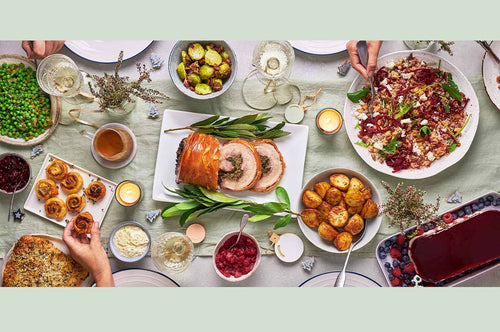Festive Christmas table spread with roast, sides, and desserts from The Dinner Ladies.