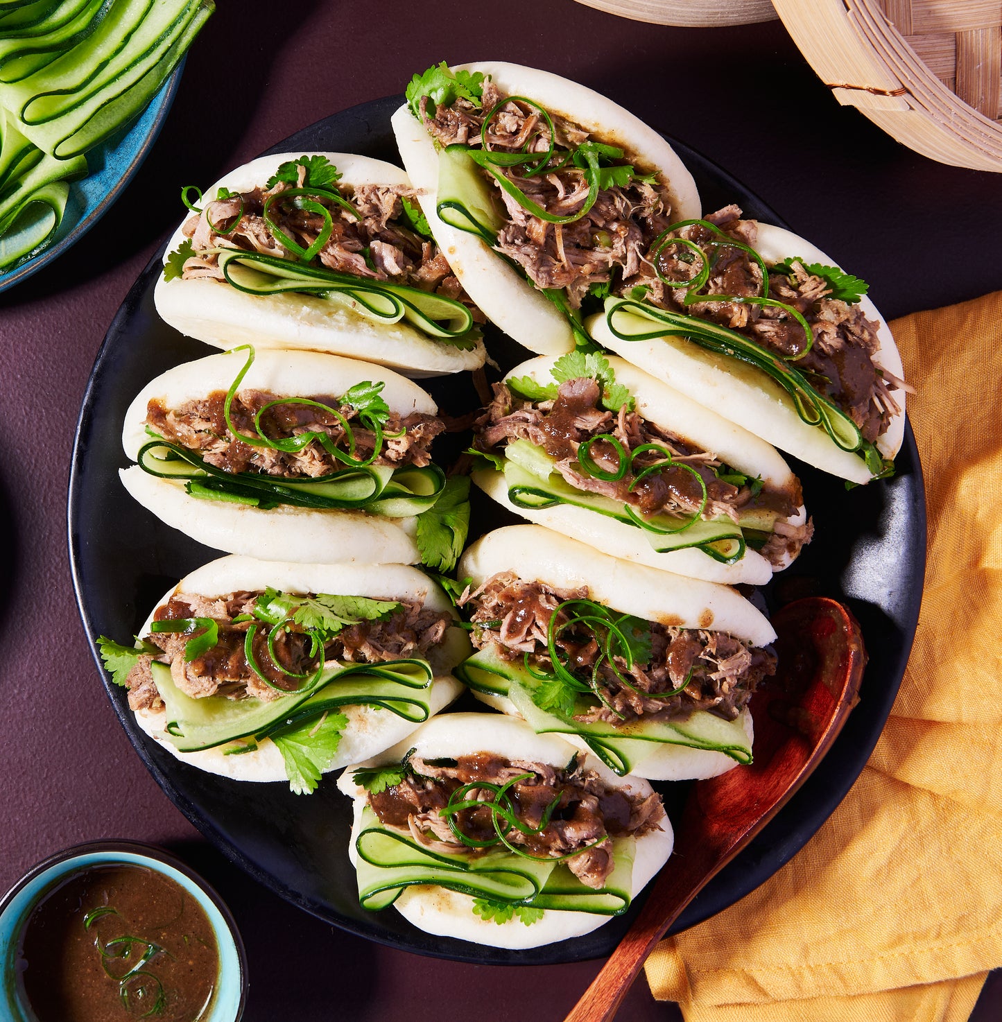 Bao buns with slow-cooked hoisin pork with cucumber and coriander