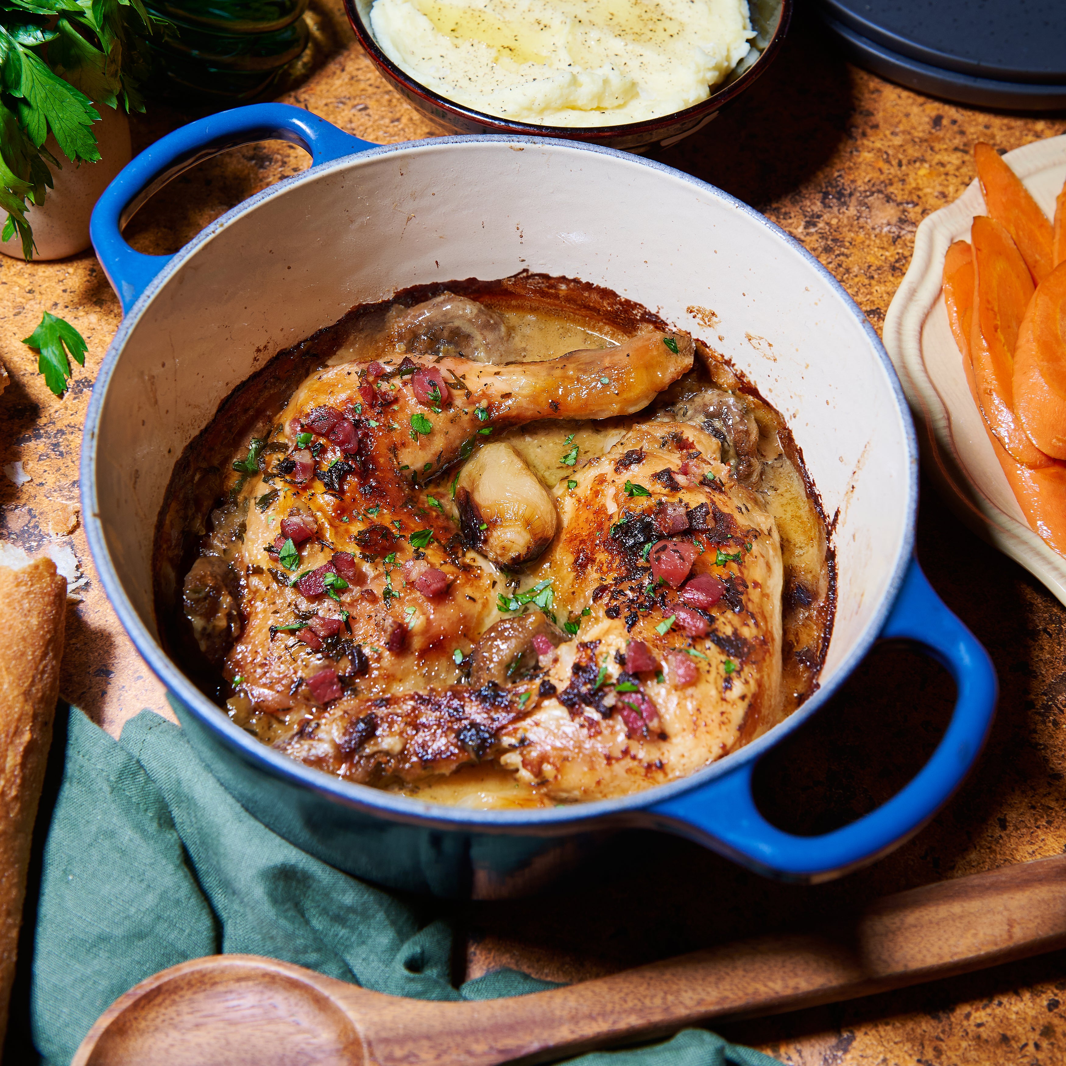 Coq a vin blanc in casserole dish