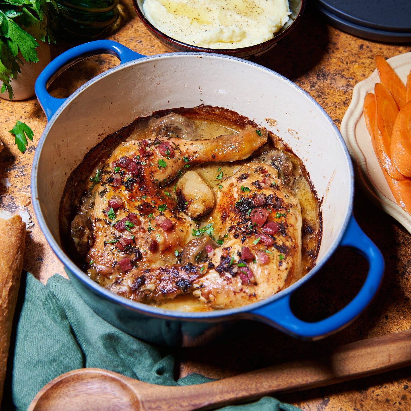 Coq a vin blanc in casserole dish