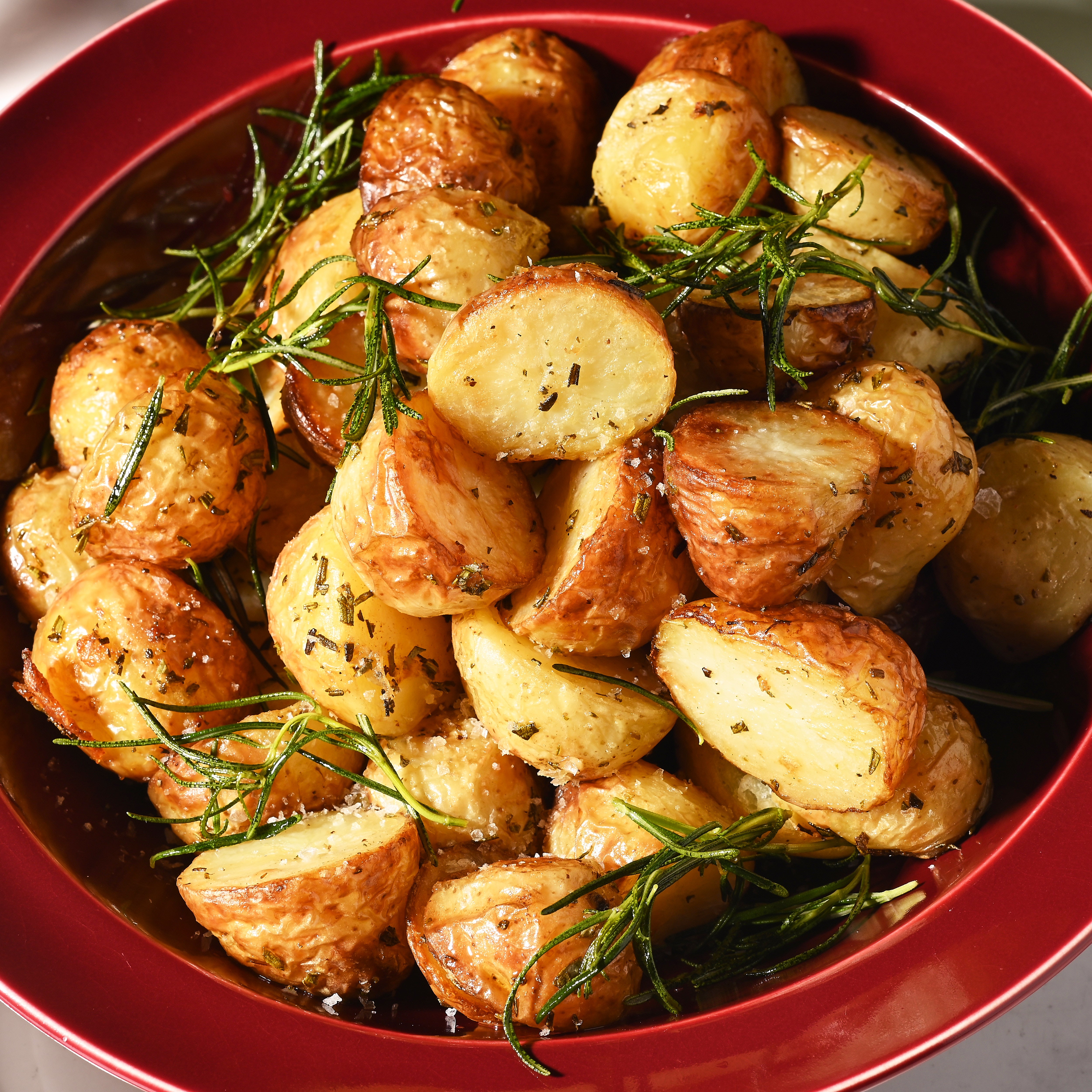 Christmas Duck fat potatoes with garlic and rosemary close up shot
