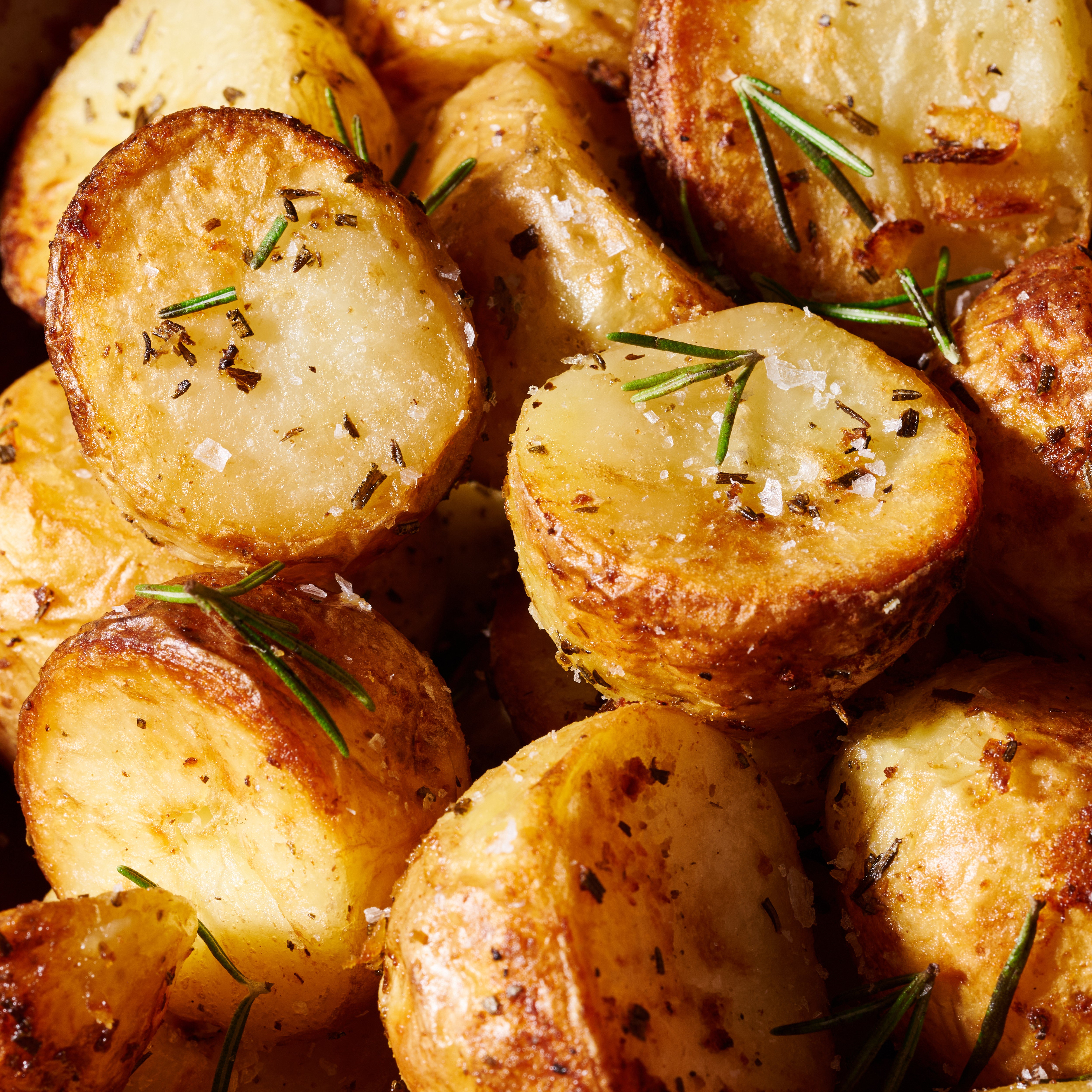 Golden crispy duck fat potatoes with garlic and rosemary 