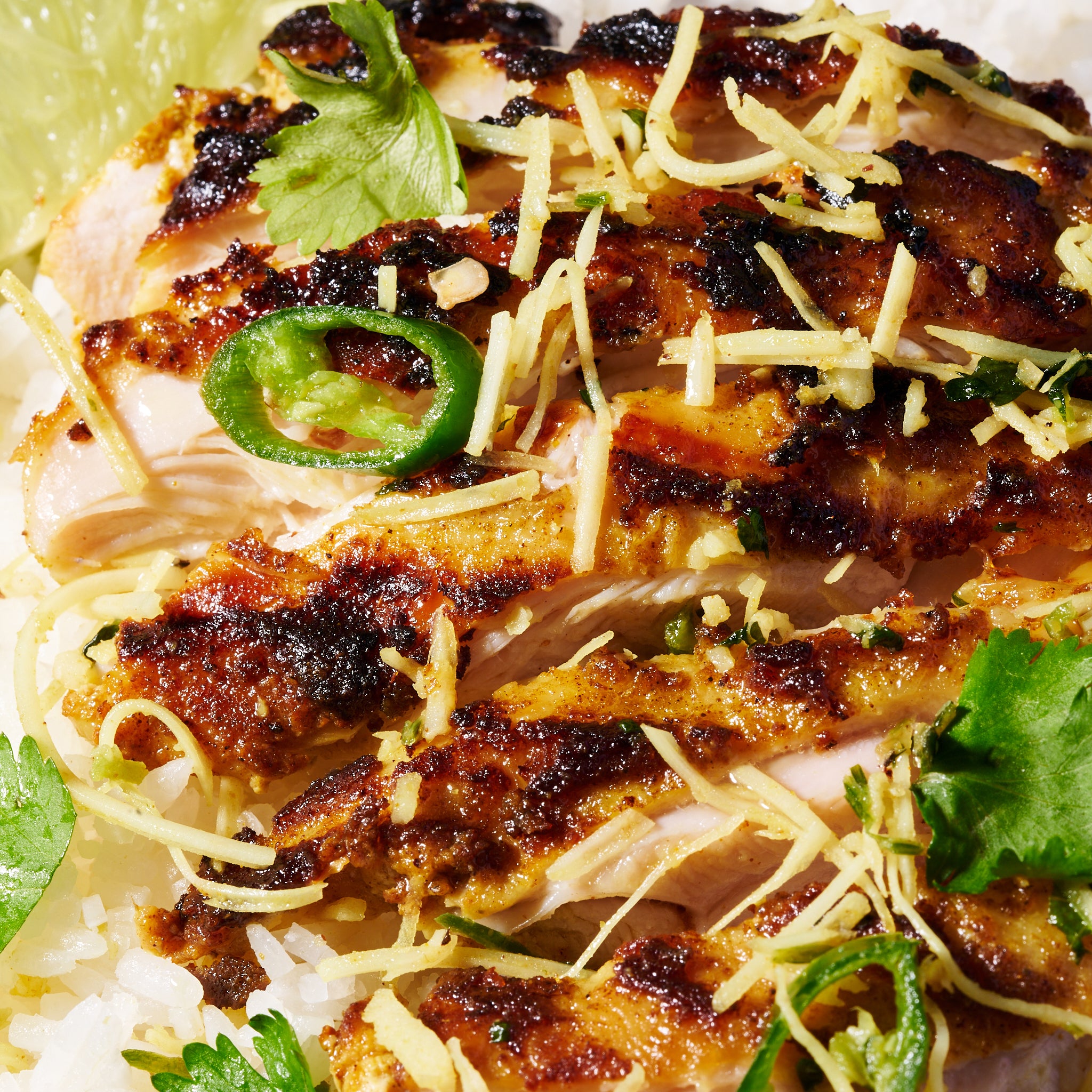 Malaysian marinated chicken thighs with coconut-coriander sambal close up 