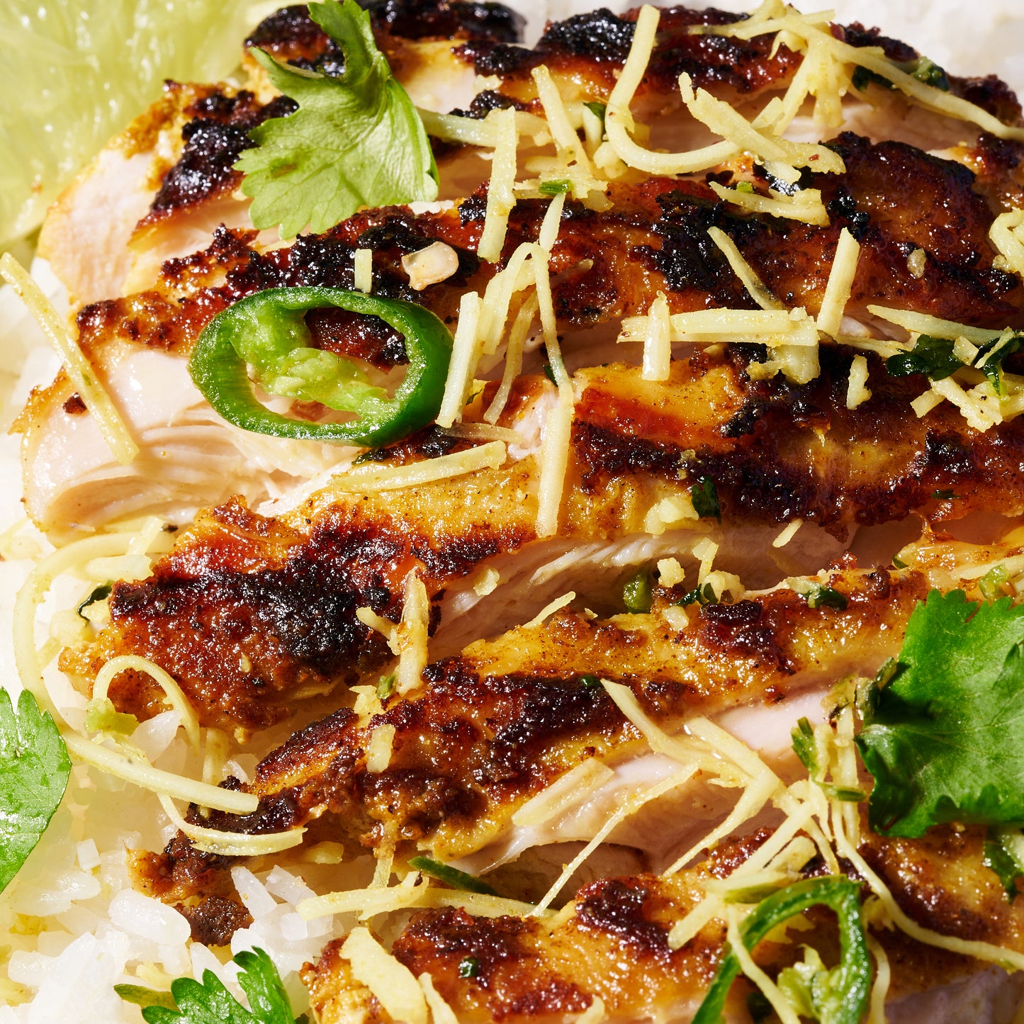 Malaysian marinated chicken thighs with coconut-coriander sambal close up 