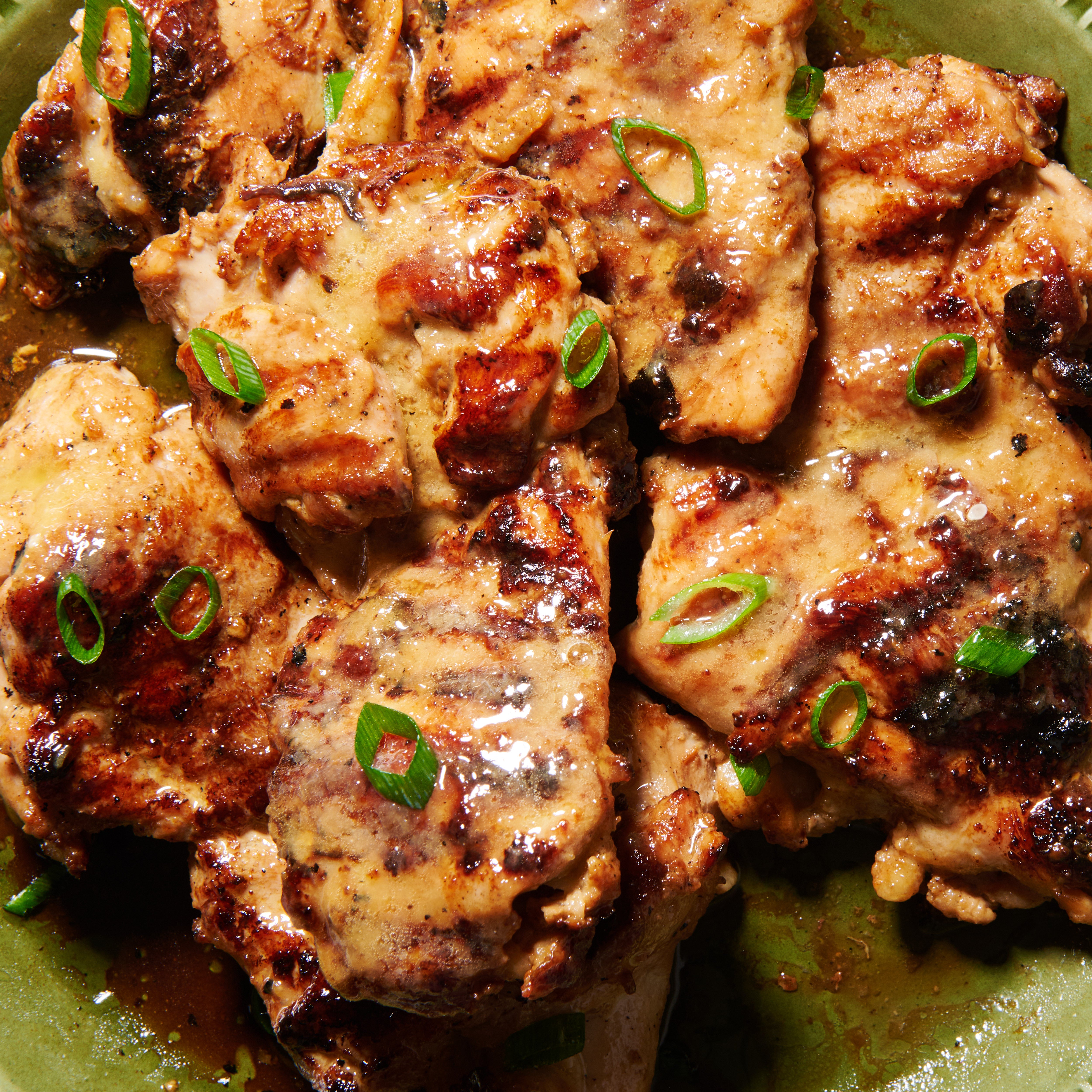 Marinated chicken thighs with miso-maple butter close up 