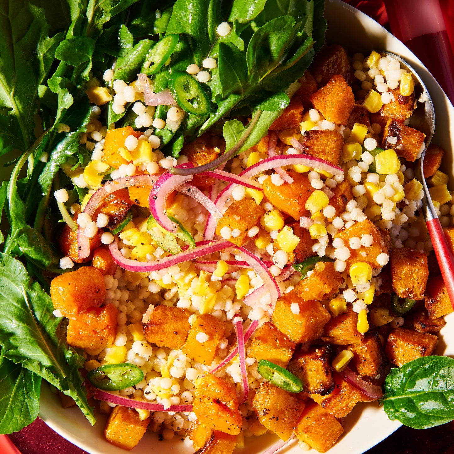 Pearl cous cous with roasted pumpkin and creamy parmesan dressing close up