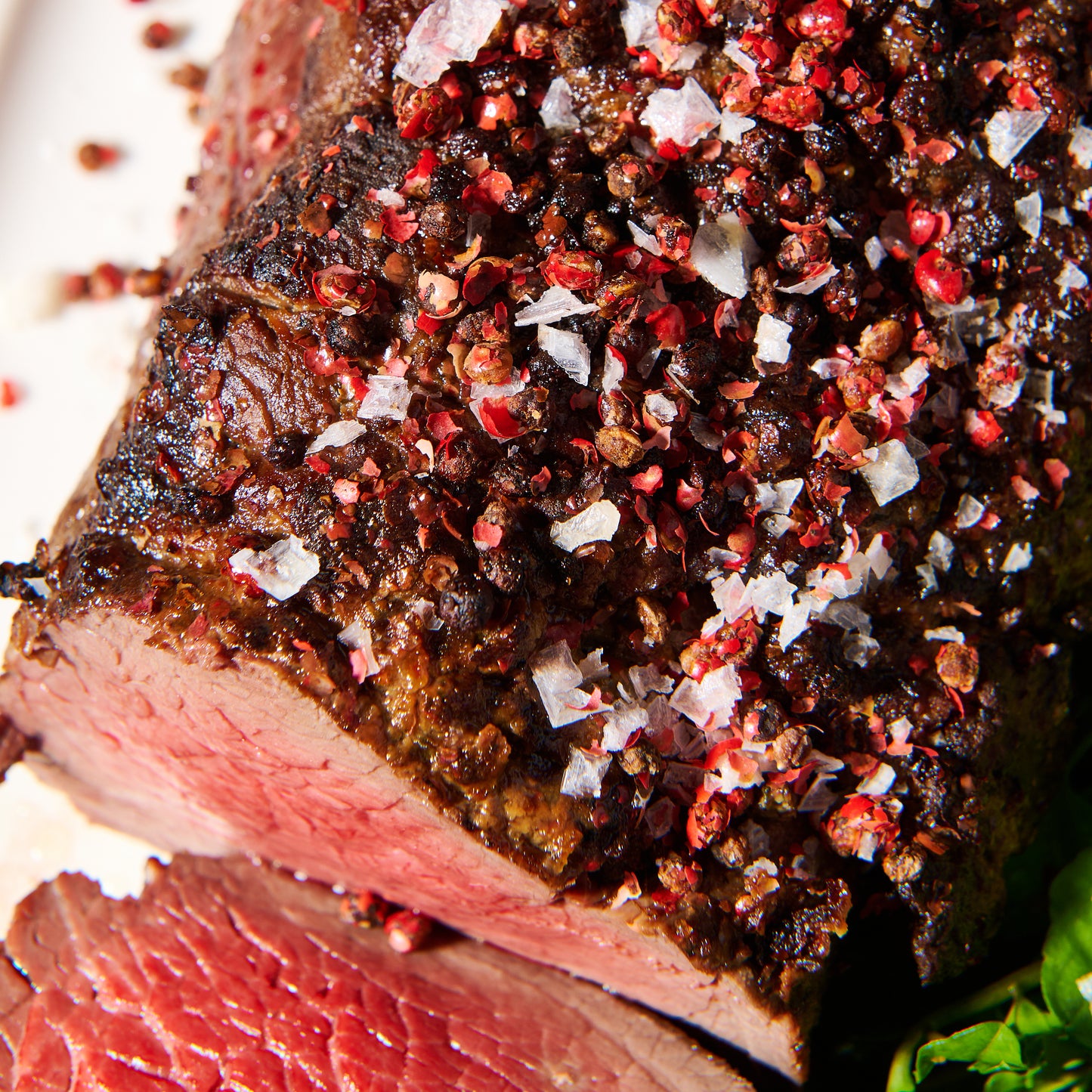 Pink pepper eye fillet with tarragon cream close up