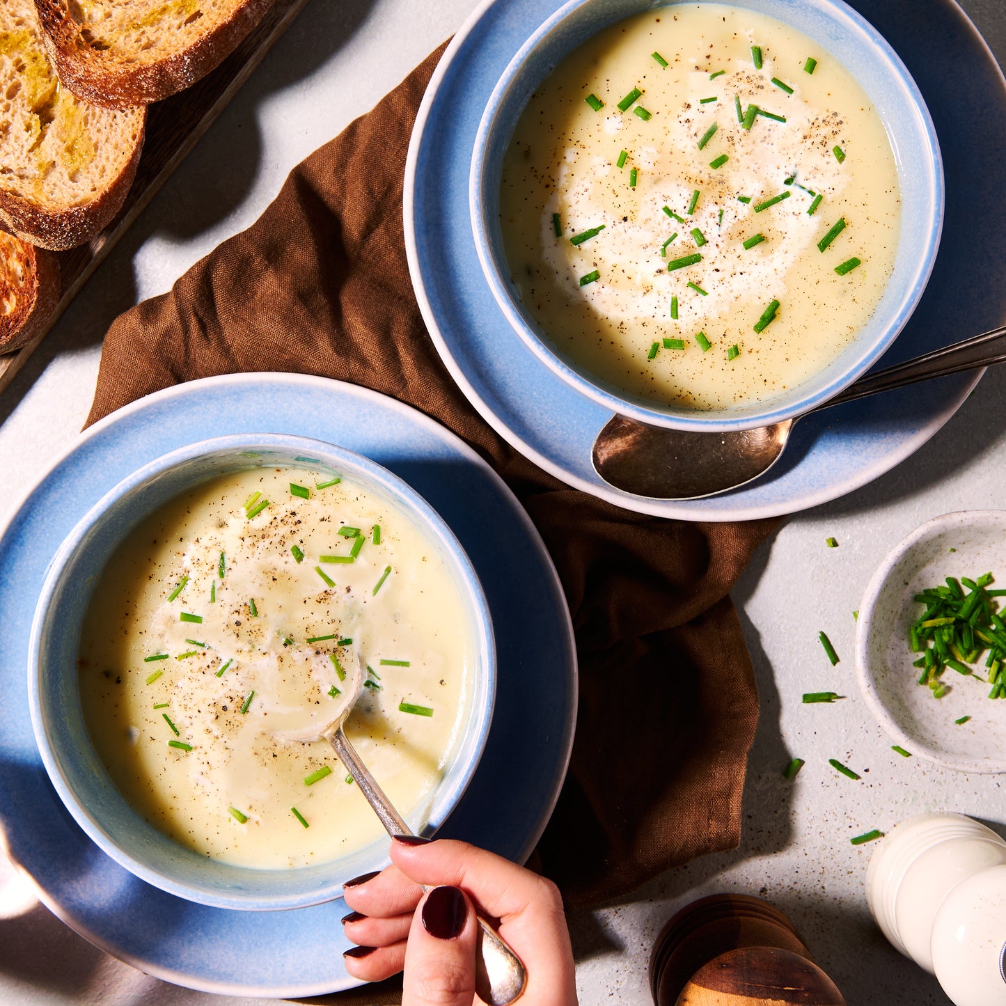 Potato, leek and chive soup in two bowls