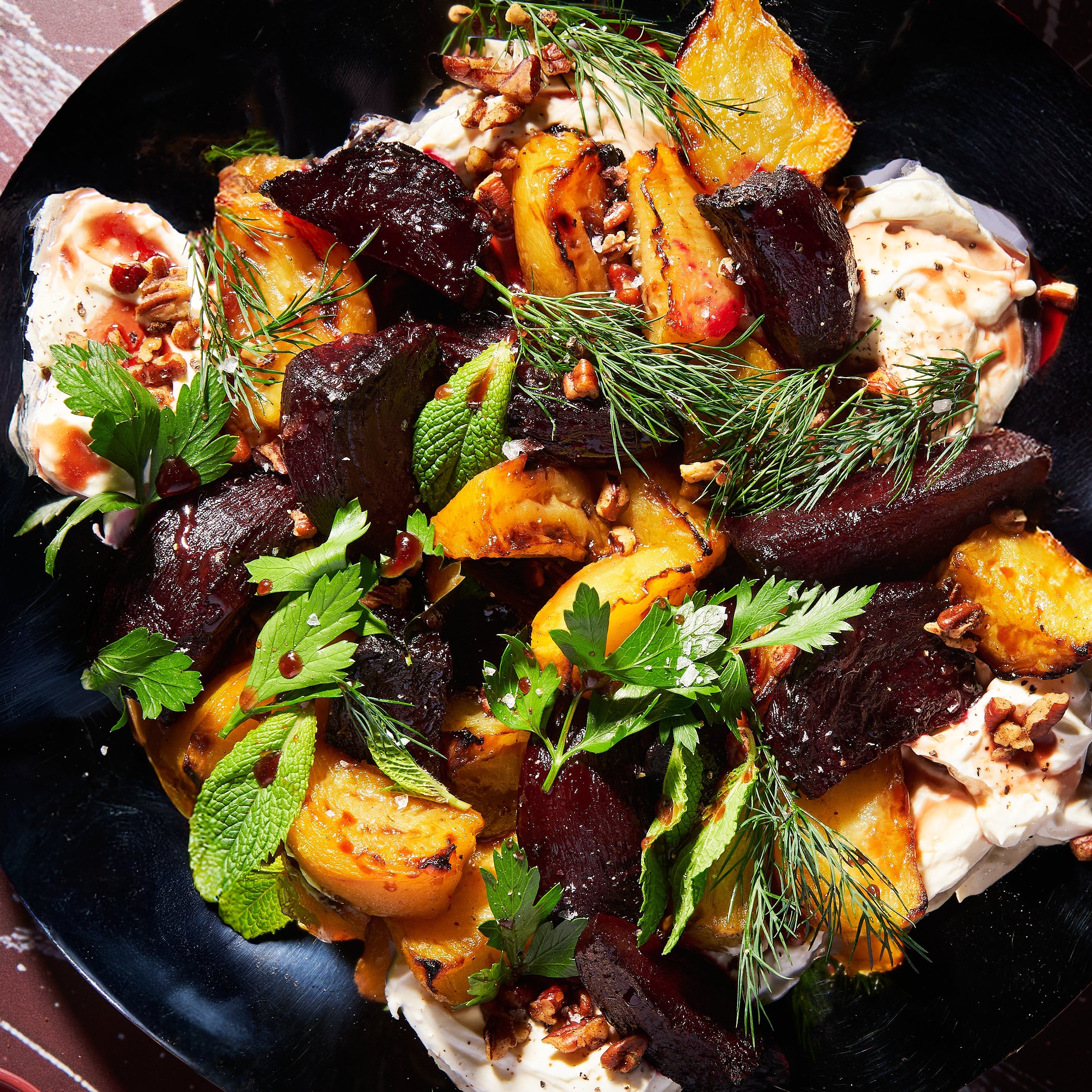 Roast beetroot with whipped fetta, pecans and pomegranate dressing close up