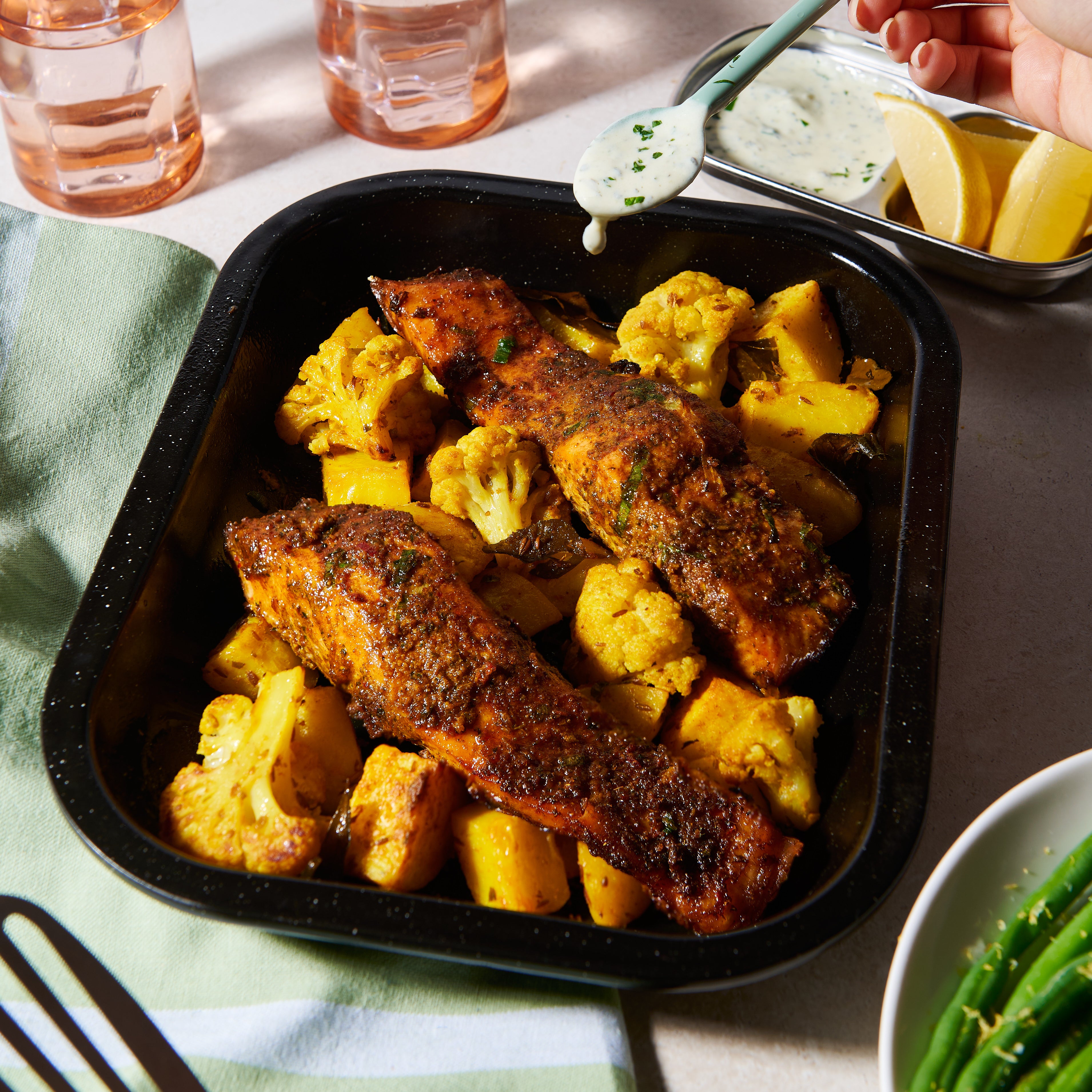 Salmon tikka tray bake with turmeric spiced potatoes and cauliflower