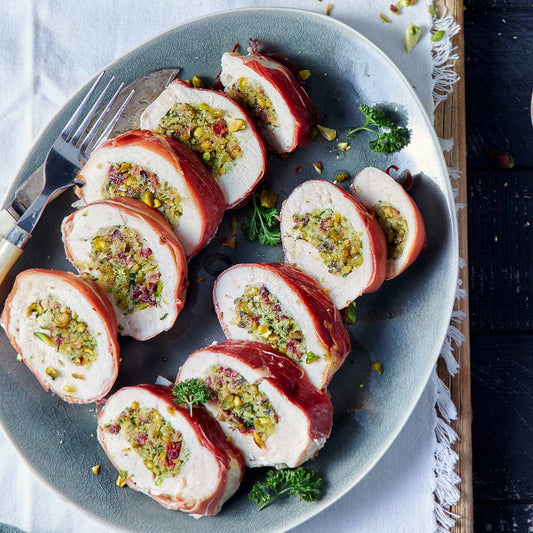 Prosciutto wrapped chicken, cranberry and pistachio ballotine